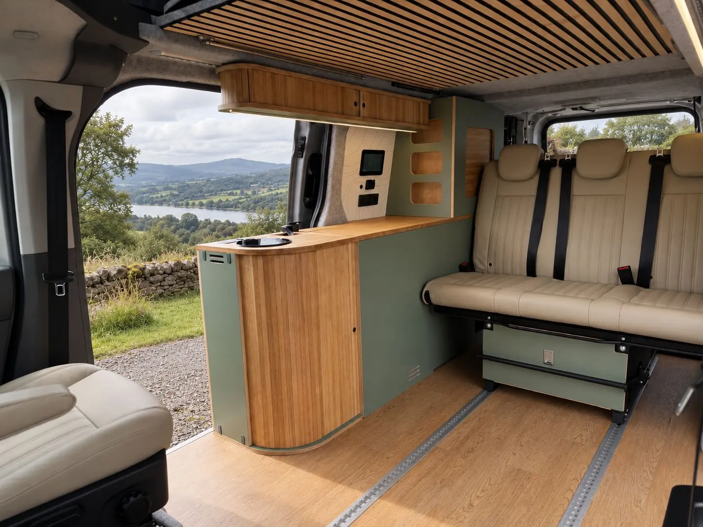 Brighton layout with a compact sage kitchen pod, cream three-seat bench and the tourer storage module behind