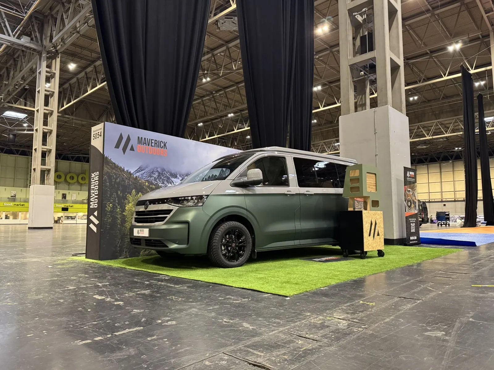 A green and grey Maverick camper on the Maverick Outdoors exhibition stand