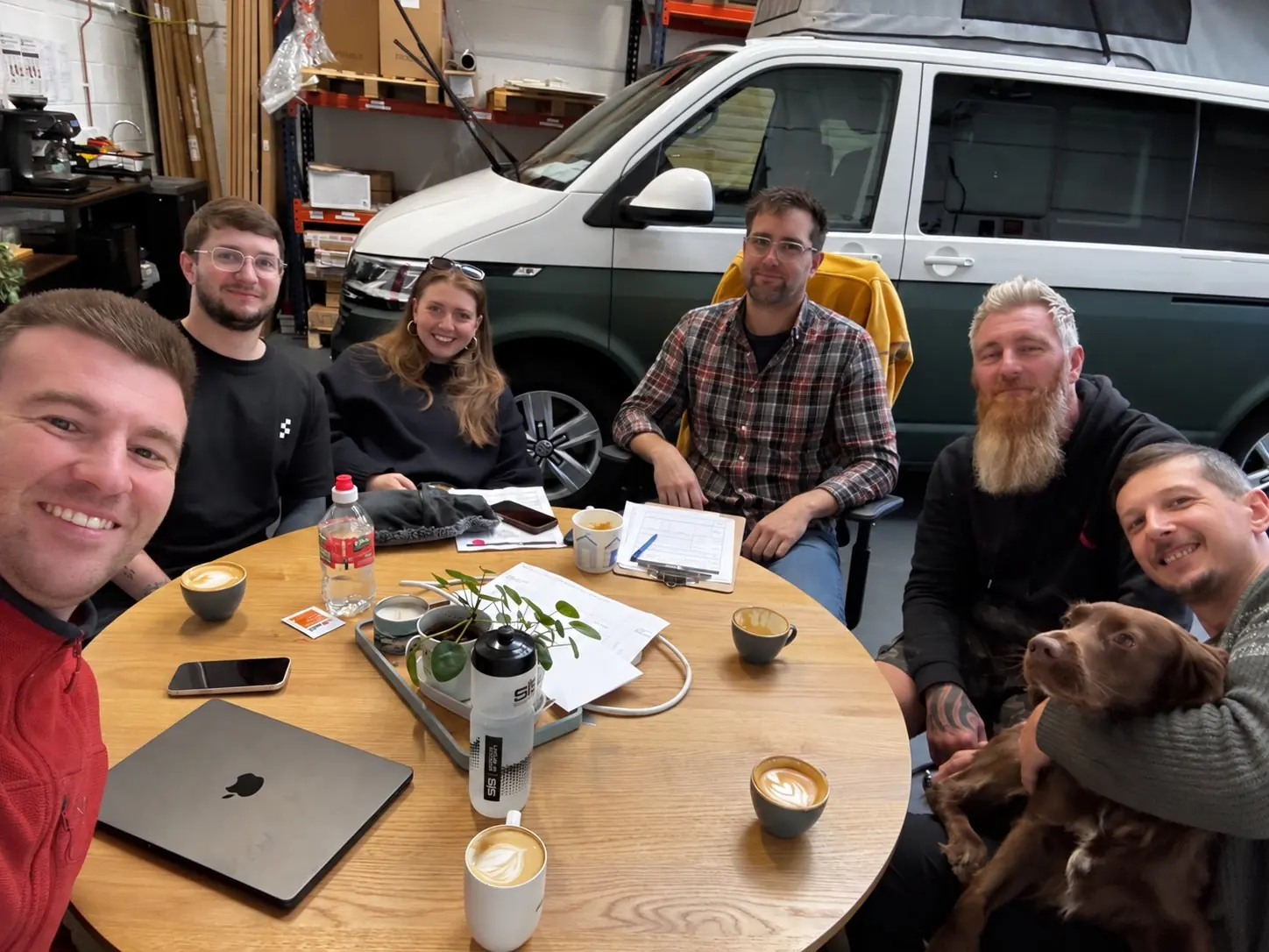 Five of the Maverick Outdoors team smiling with Maverick the spaniel